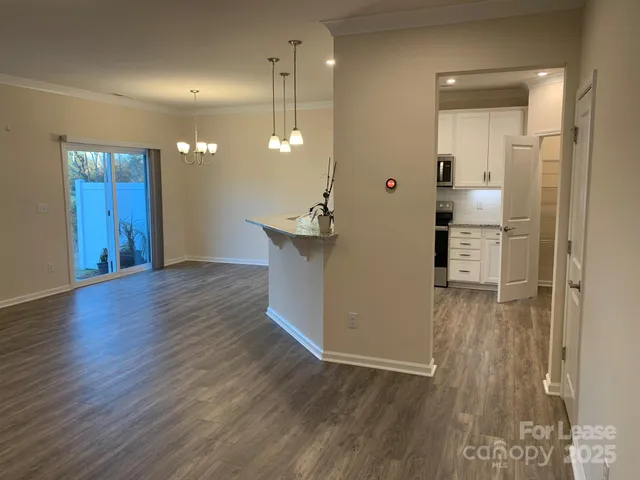 a view of a kitchen cabinets and wooden floor