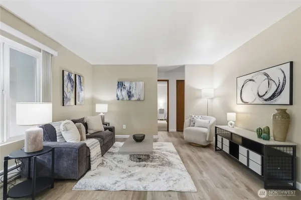 a living room with furniture and a rug