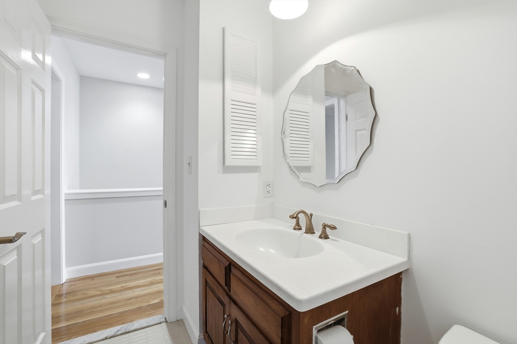 74 Branch Street, Unit 15 Scituate, MA 02066 - Photo 16 of 26 a bathroom with a sink and a mirror