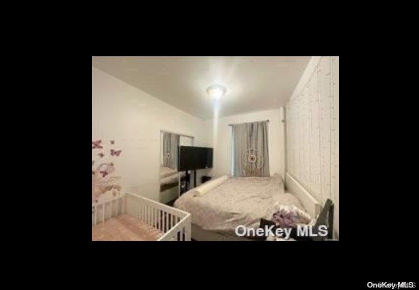 21-78 35th Street, Unit 5F Queens, NY 11105 - Photo 5 of 8 a view of living room with furniture and flat screen tv