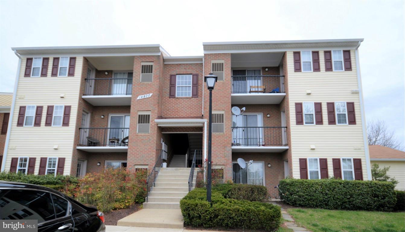 14800 Rydell Road, Unit 204 Centreville, VA 20121 - Photo 1 of 9 a front view of a house with parking space
