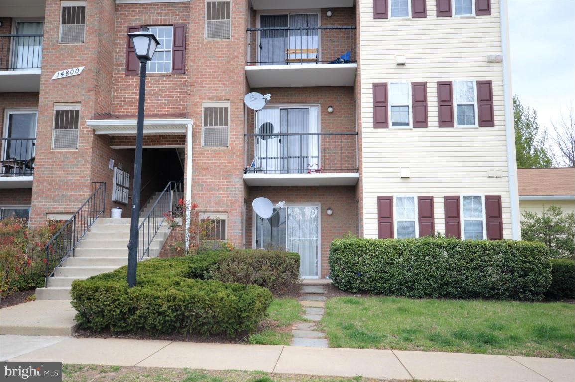 14800 Rydell Road, Unit 204 Centreville, VA 20121 - Photo 2 of 9 a front view of a building with garden