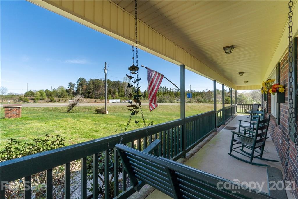 2335 Elbow Road Newton, NC 28658 - Photo 5 of 33 a view of a porch with furniture and garden
