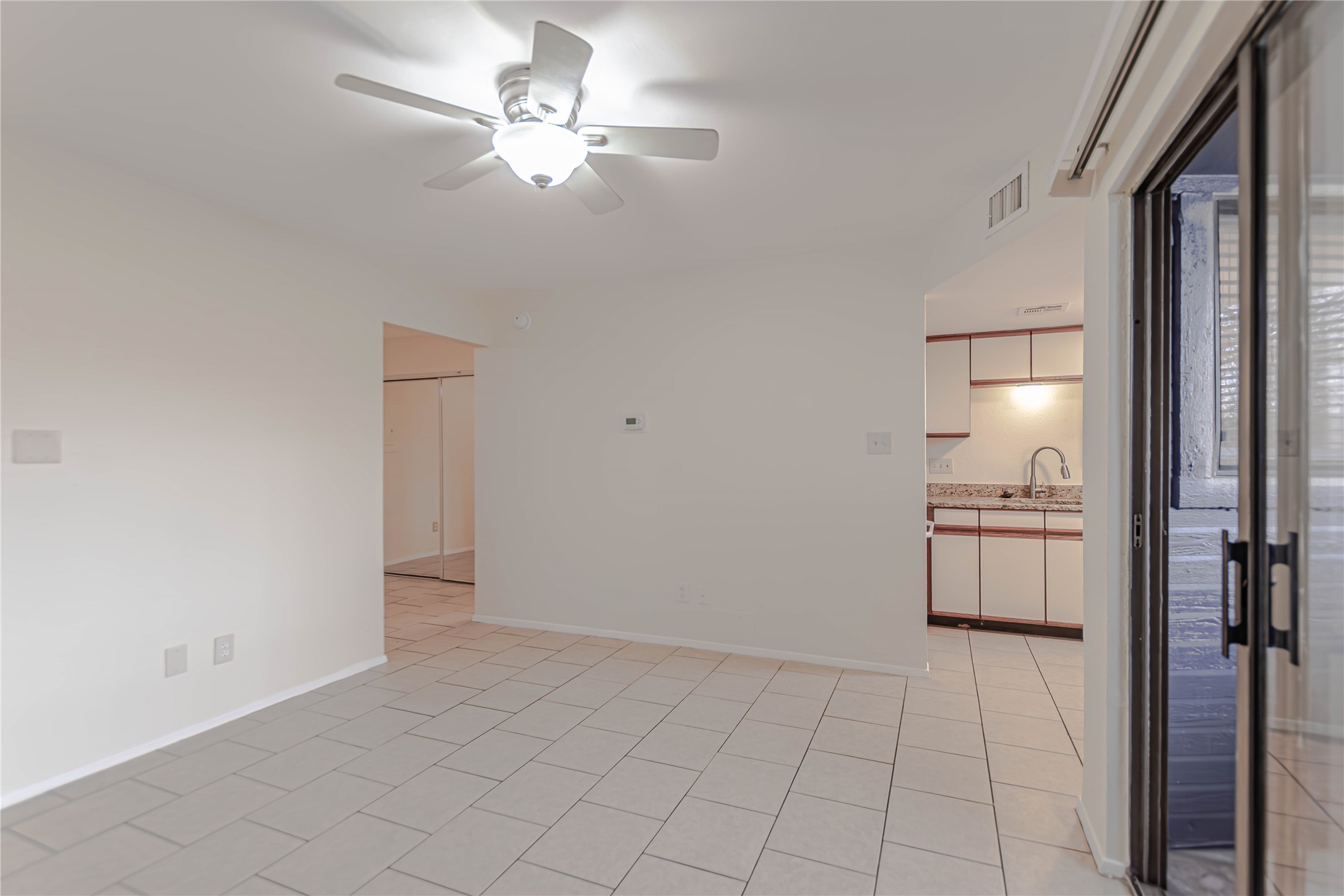 2500 Burleson Road, Unit 601 Austin, TX 78741 - Photo 4 of 20 a view of an empty room and chandelier fan
