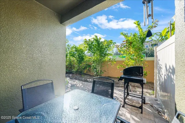 a view of a balcony with chairs
