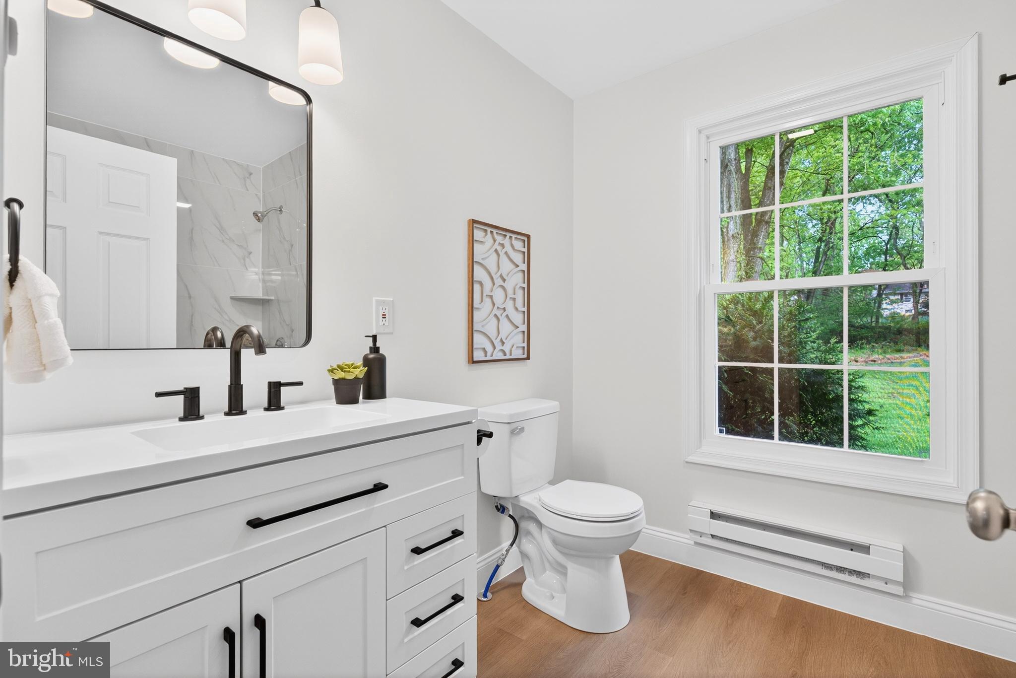 503 Whitman Lane Middletown, PA 17057 - Photo 37 of 58 a bathroom with a toilet sink a window and mirror