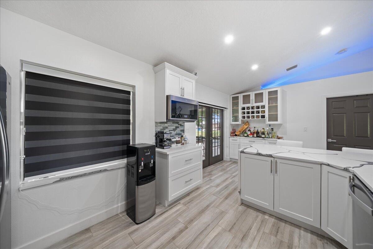 613 Grant Road Palm Bay, FL 32909 - Photo 11 of 40 a kitchen with a sink stainless steel appliances and cabinets