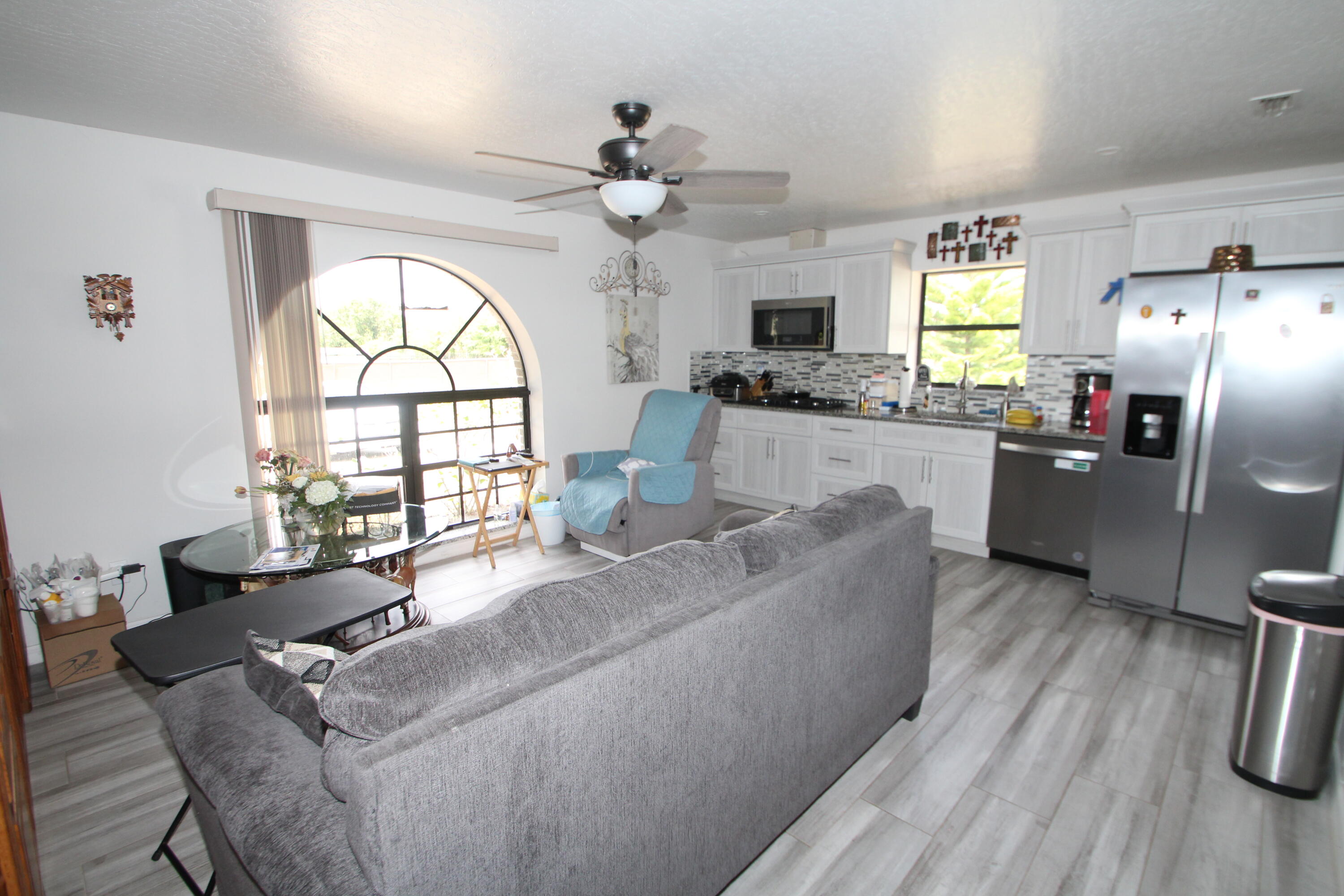 613 Grant Road Palm Bay, FL 32909 - Photo 22 of 40 a living room with furniture and a large window