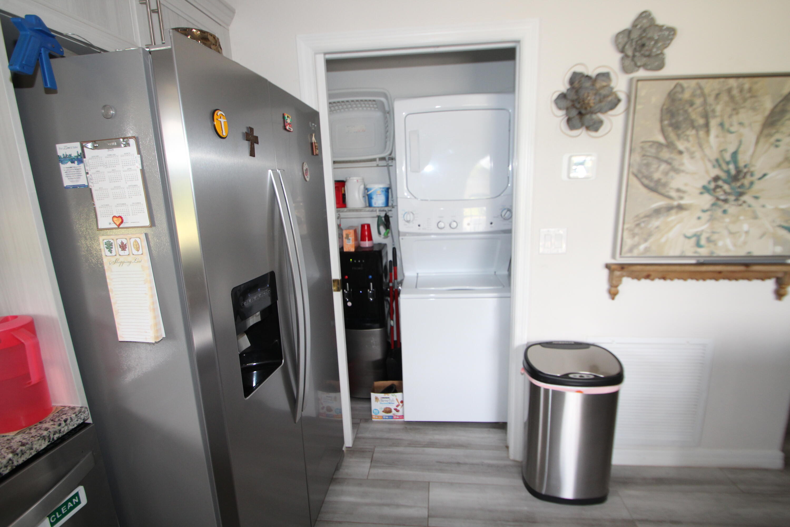613 Grant Road Palm Bay, FL 32909 - Photo 26 of 40 a kitchen with a refrigerator and a stove