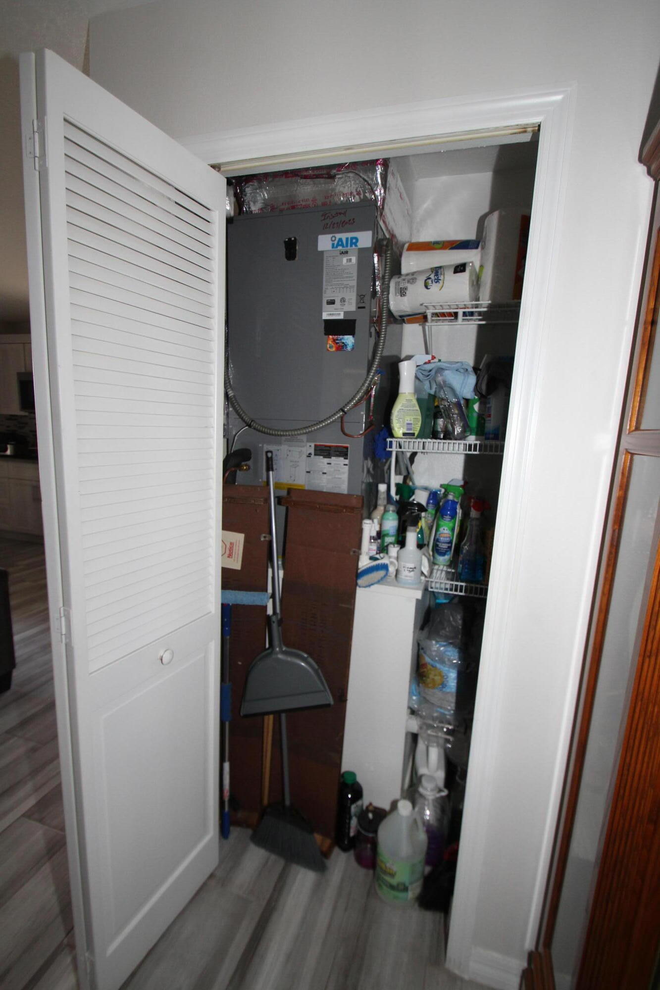613 Grant Road Palm Bay, FL 32909 - Photo 27 of 40 a room with wooden floor and furniture