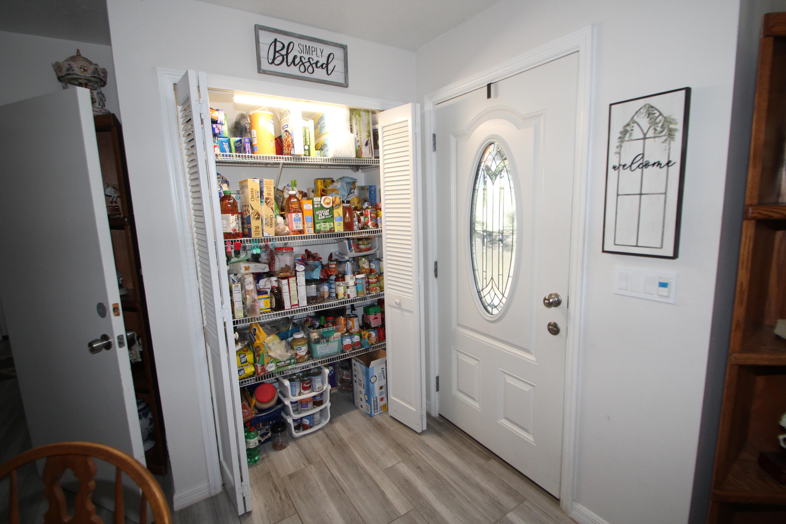 613 Grant Road Palm Bay, FL 32909 - Photo 28 of 40 a view of walk in closet with clothes and shoes