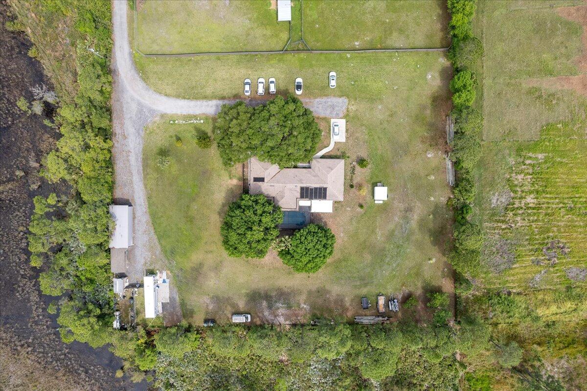 613 Grant Road Palm Bay, FL 32909 - Photo 32 of 40 a bathroom with a sink and mirror