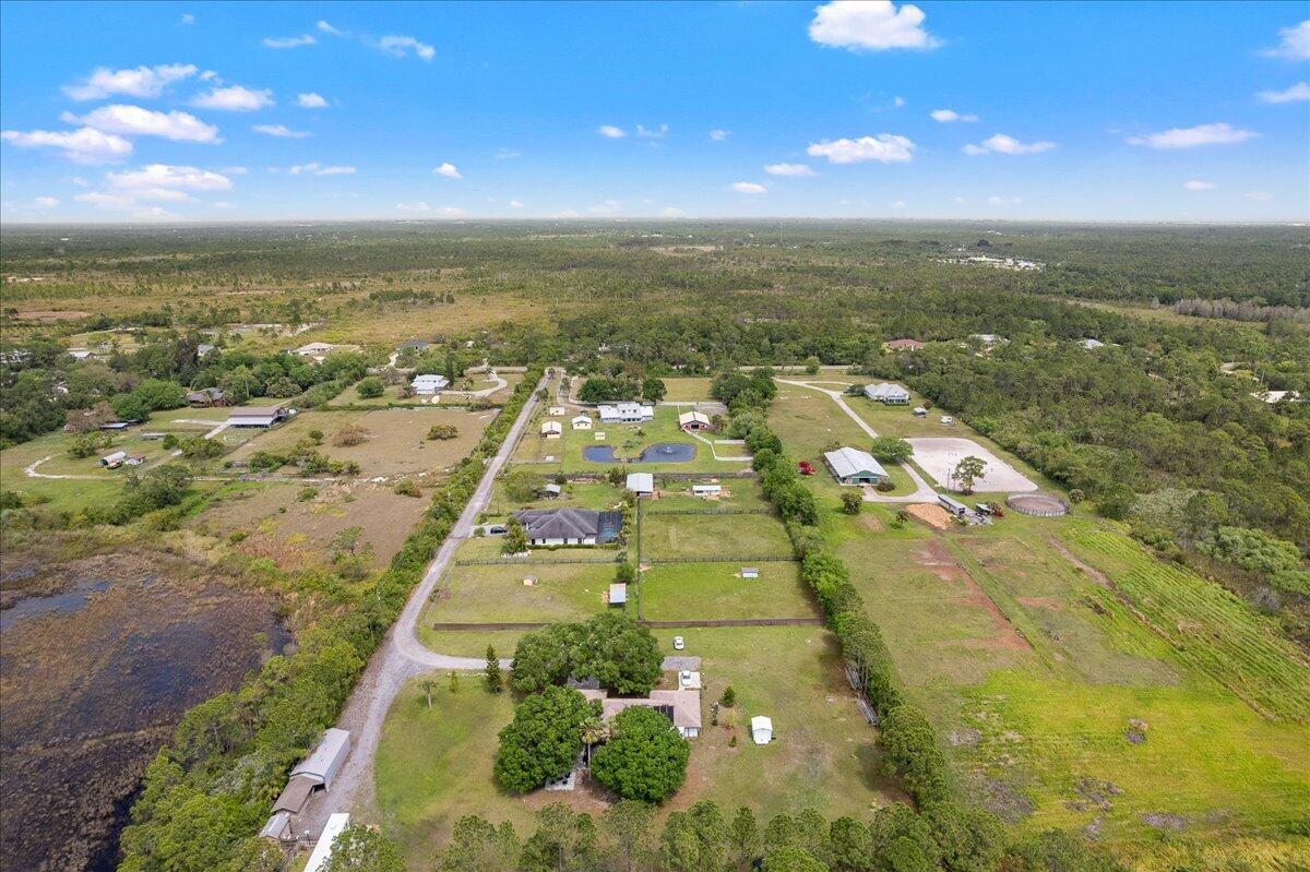 613 Grant Road Palm Bay, FL 32909 - Photo 33 of 40 an aerial view of residential houses with outdoor space