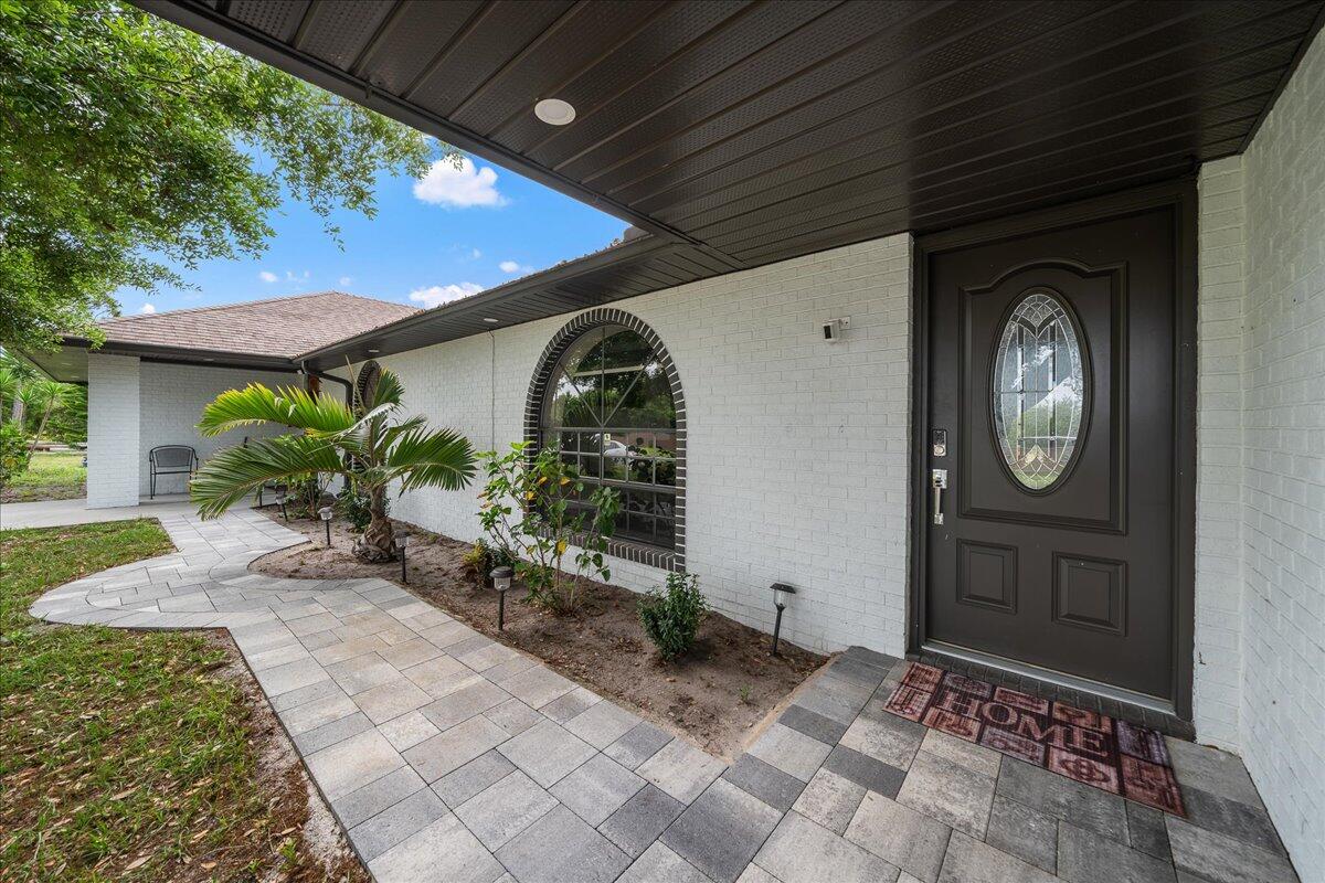 613 Grant Road Palm Bay, FL 32909 - Photo 4 of 40 a view of a entryway door front of house