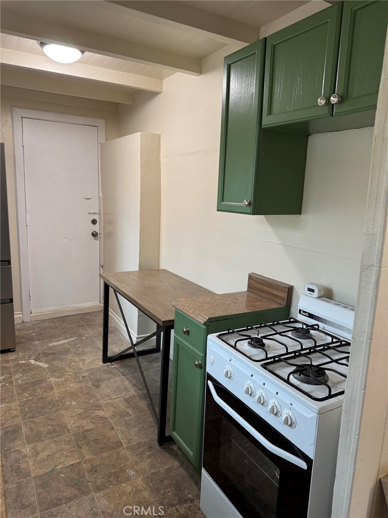 369 Log Crestline, CA 92325 - Photo 5 of 12 a kitchen with a stove and a microwave