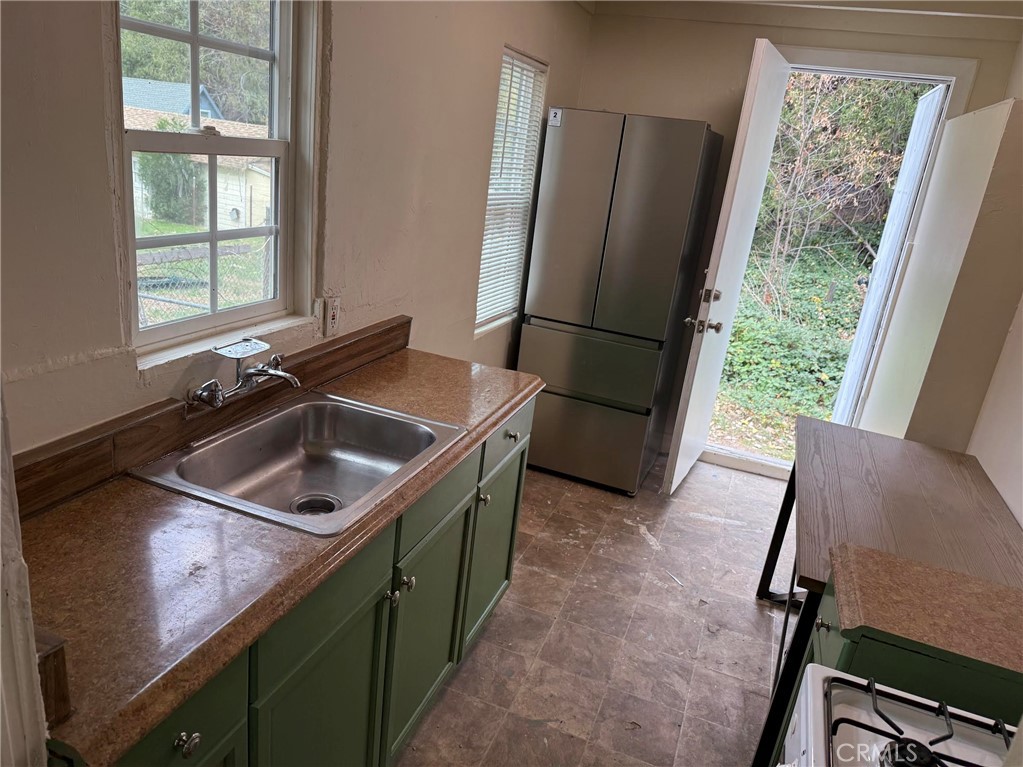 369 Log Crestline, CA 92325 - Photo 7 of 12 a kitchen that has a sink and a window
