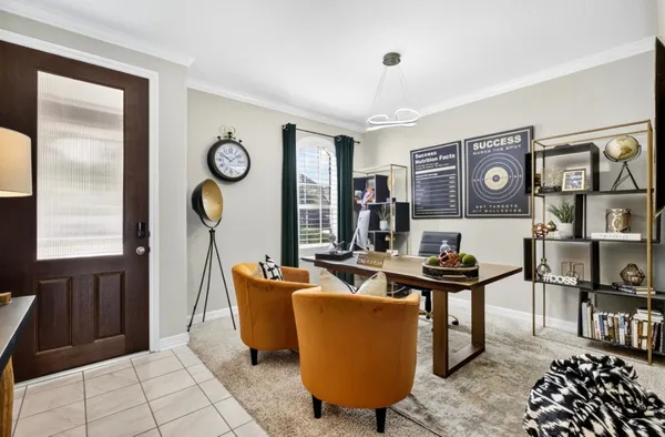 a living room with furniture a window and wall painting
