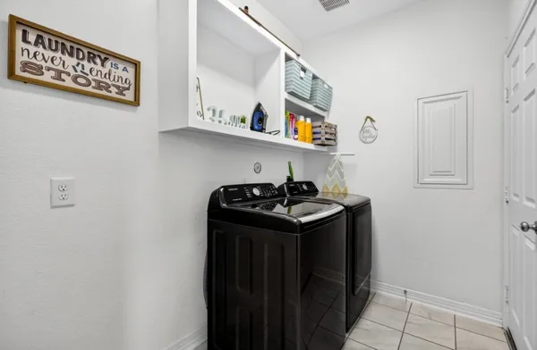 a utility room with dryer and washer