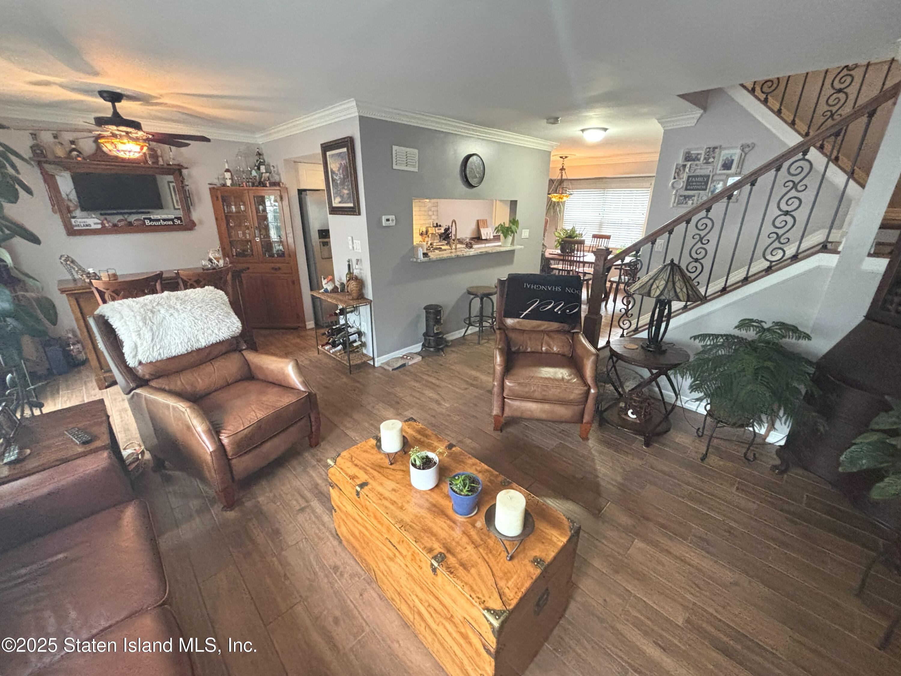 73 Hampton Green Staten Island, NY 10312 - Photo 19 of 28 a living room with furniture and wooden floor