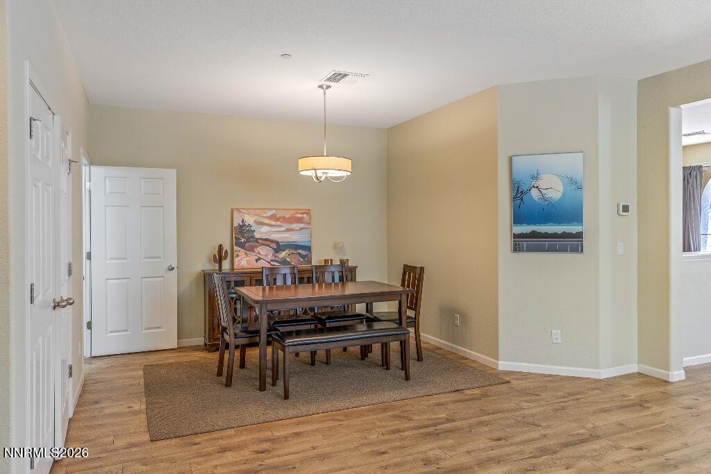 1864 Wind Ranch Road, Unit B Reno, NV 89521 - Photo 8 of 42 a view of a dining room with furniture