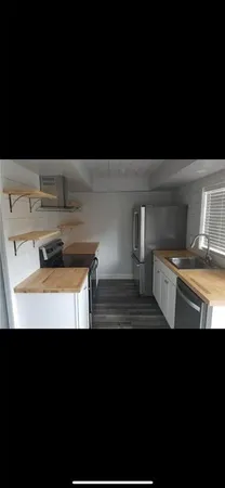 a view of a kitchen with a sink