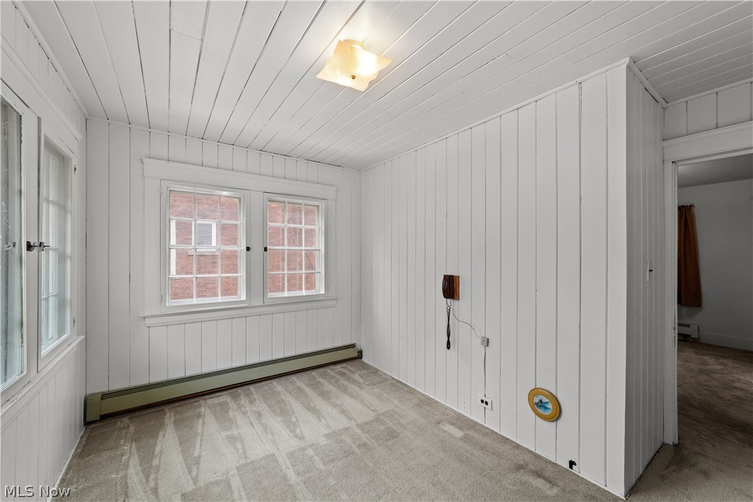 3030 East Overlook Road Cleveland, OH 44118 - Photo 18 of 24 Spare room with a baseboard heating unit and light carpet