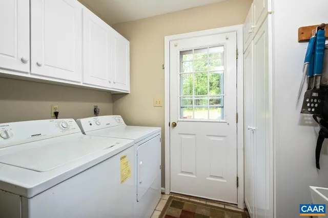 a bedroom with a bed wooden floor and window