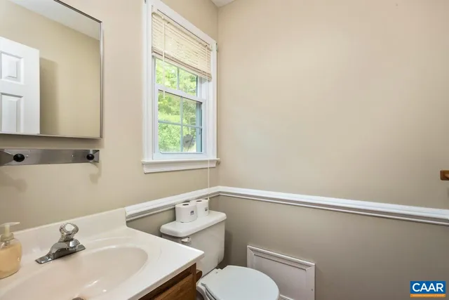 a bedroom with a bed and a potted plant
