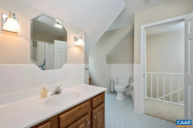a view of a room with kitchen appliances and furniture