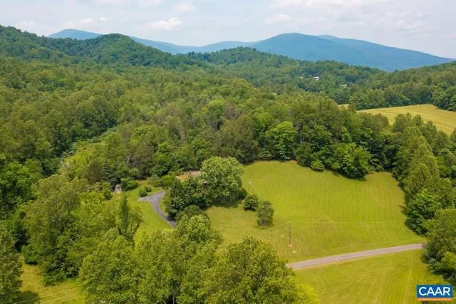 a view of a swimming pool with a yard