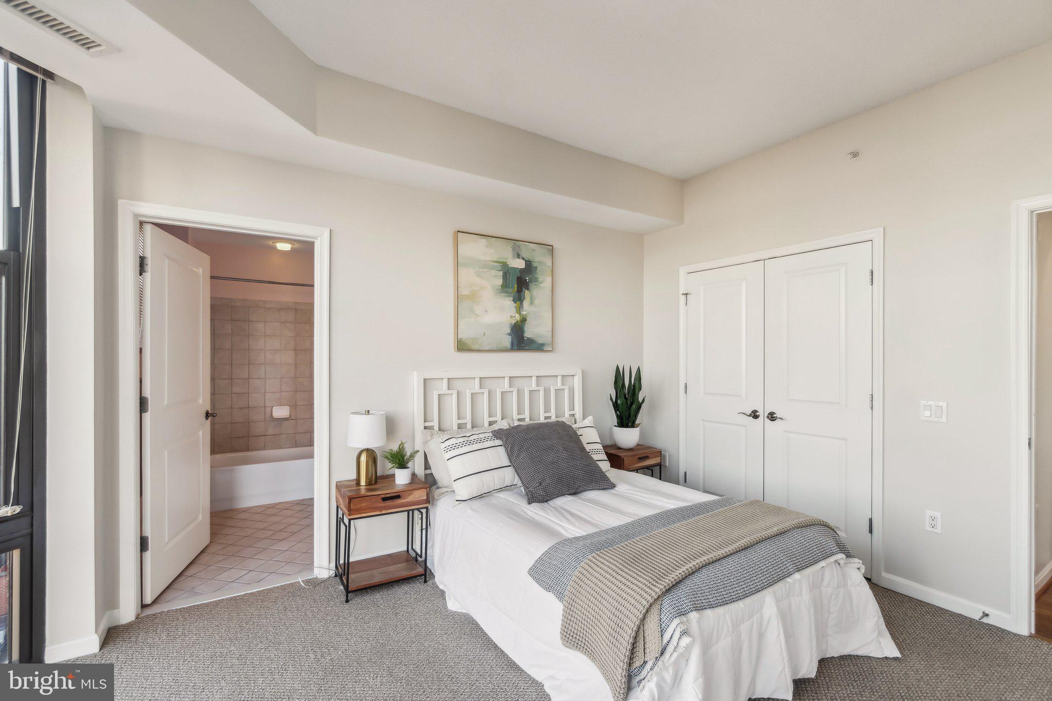 1390 Kenyon Street Northwest, Unit 510 Washington, DC 20010 - Photo 11 of 39 a bedroom with a bed and a painting