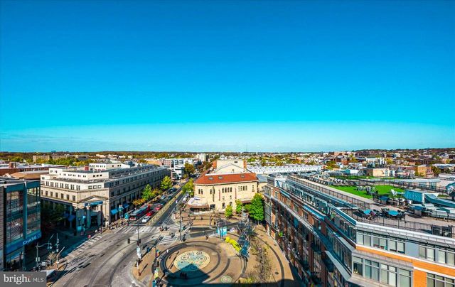 a backyard of a house with barbeque oven table and chairs