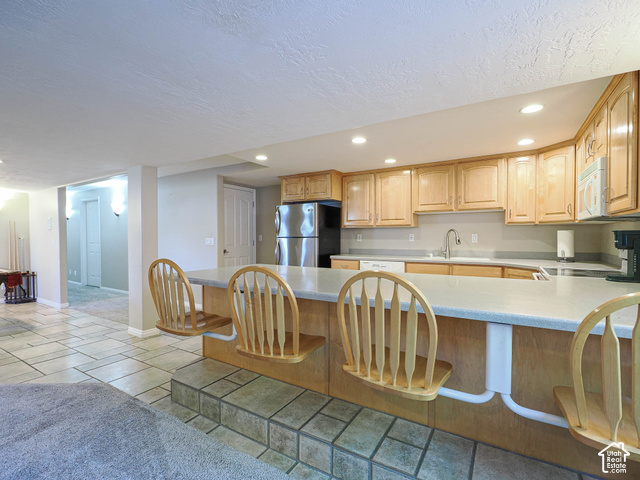 11779 South Stone Ridge Court Ridge West Riverton, UT 84065 - Photo 57 of 85 Kitchenette with wood cabinetry and an integrated breakfast bar