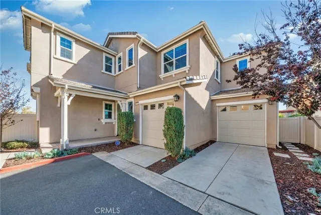 a front view of a house with a garage