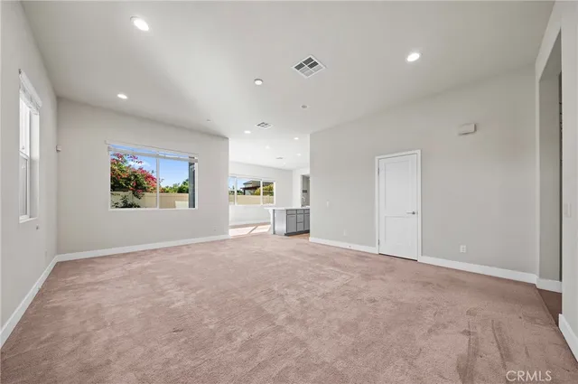 a utility room with cabinets washer and dryer