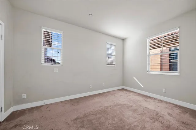 a view of a flower arrangement in backyard of a house