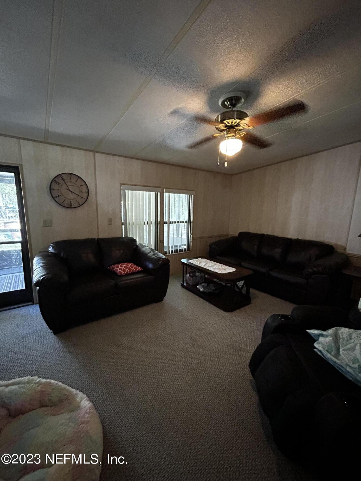 130 Walker Drive Interlachen, FL 32148 - Photo 15 of 31 a living room with furniture