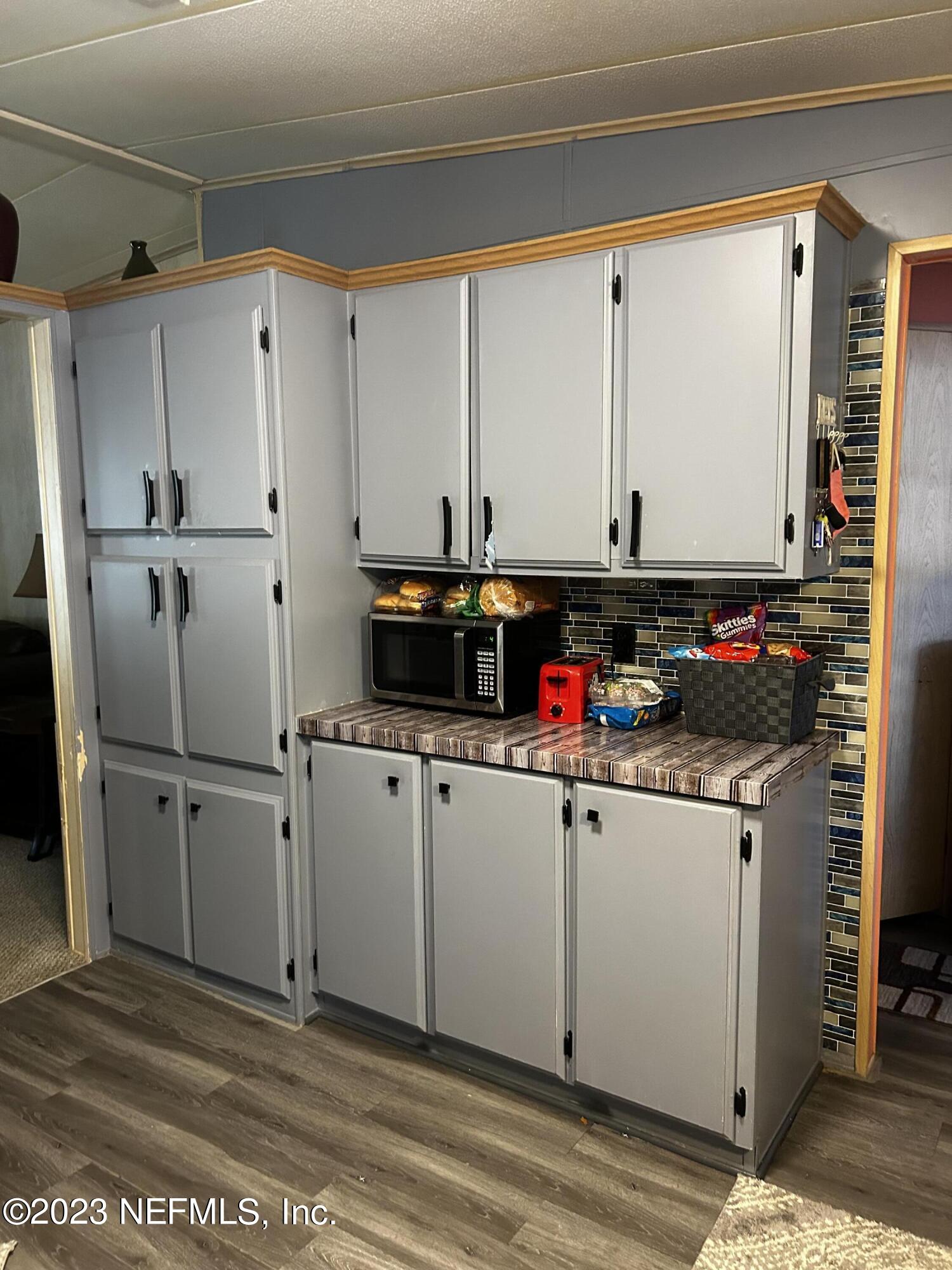 130 Walker Drive Interlachen, FL 32148 - Photo 18 of 31 a room with storage and utility