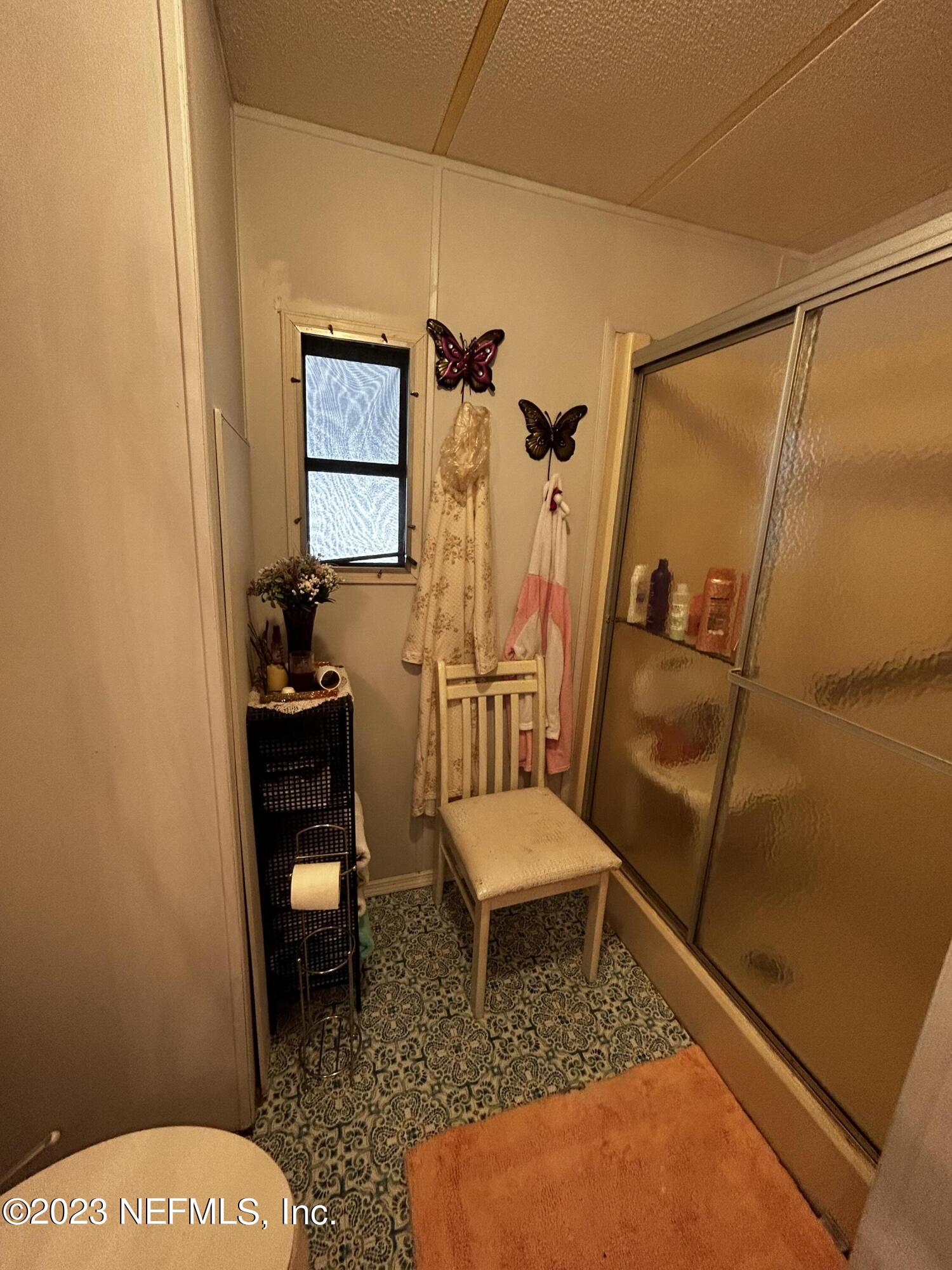 130 Walker Drive Interlachen, FL 32148 - Photo 26 of 31 a living room with a couch