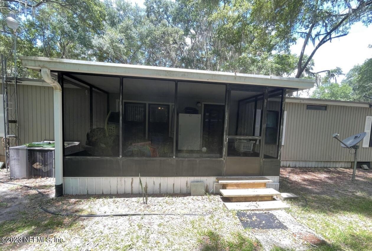 130 Walker Drive Interlachen, FL 32148 - Photo 3 of 31 a view of backyard from a balcony