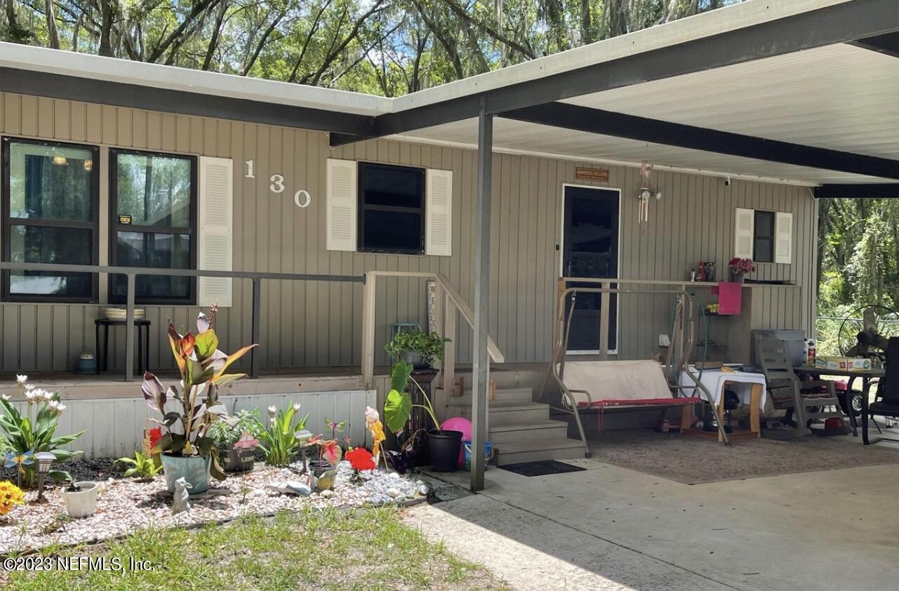 130 Walker Drive Interlachen, FL 32148 - Photo 4 of 31 a view of outdoor space yard deck patio and swimming pool