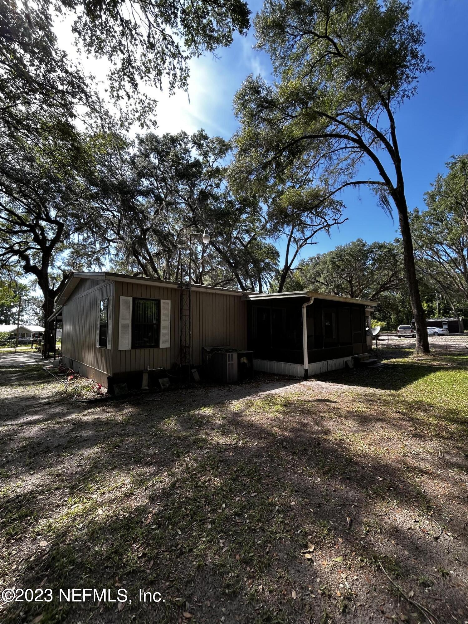 130 Walker Drive Interlachen, FL 32148 - Photo 5 of 31 a view of a house with a yard