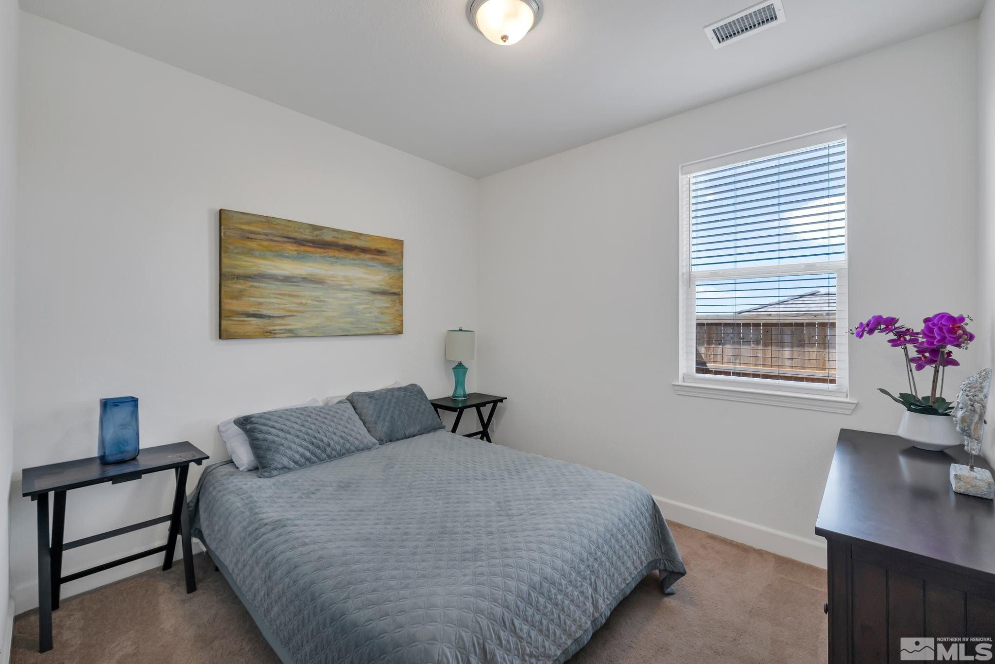 10490 Gold Mine Drive Reno, NV 89521 - Photo 26 of 40 a bedroom with a bed and a window