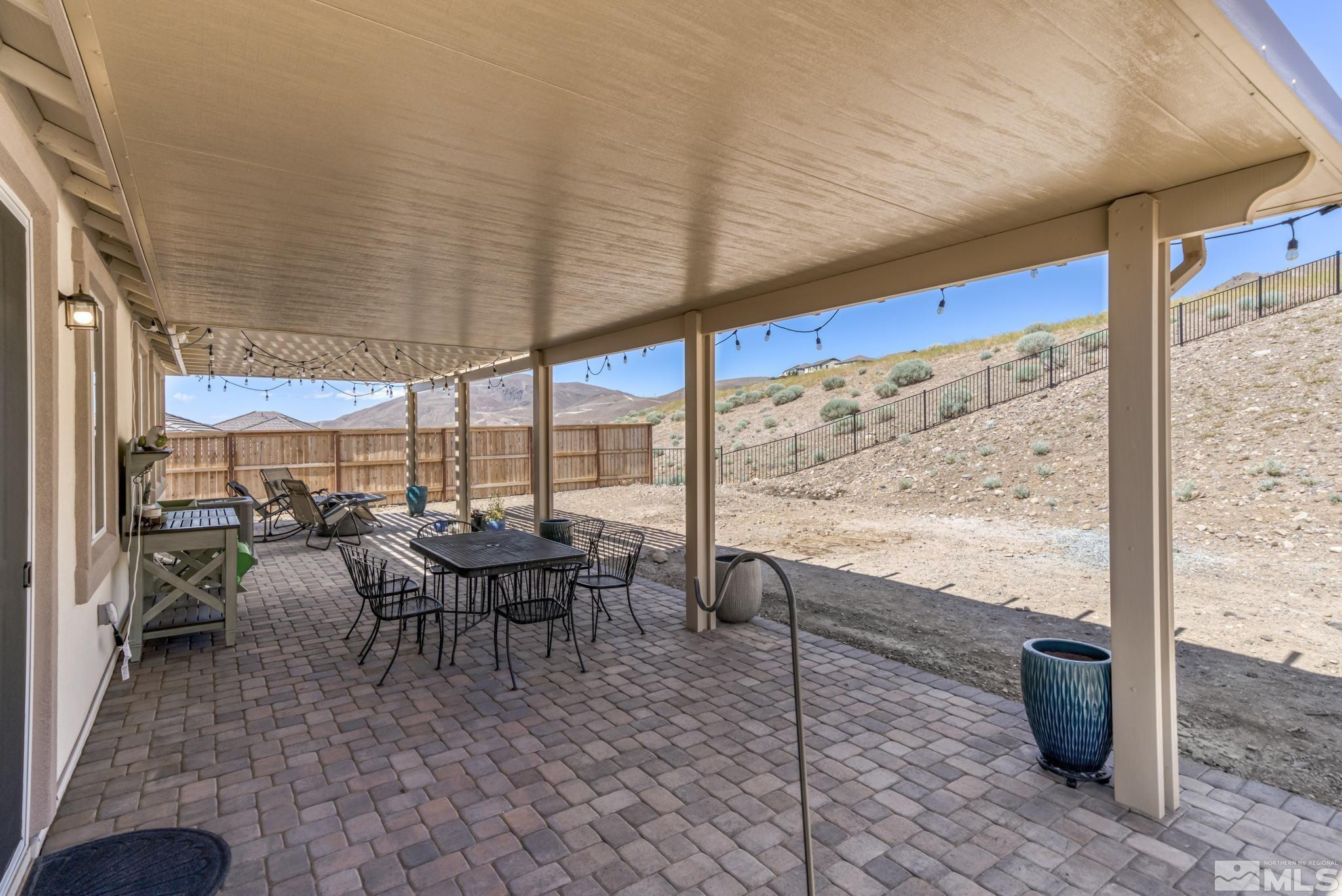 10490 Gold Mine Drive Reno, NV 89521 - Photo 29 of 40 a view of a patio with dining table and chairs