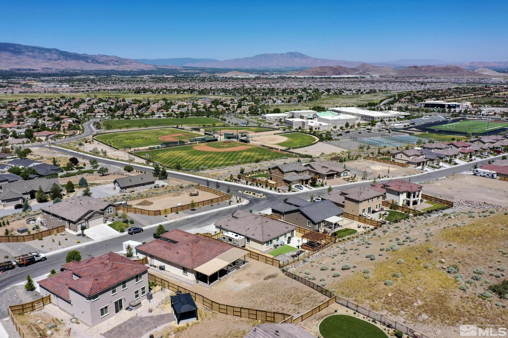 10490 Gold Mine Drive Reno, NV 89521 - Photo 38 of 40 an aerial view of a city with lots of residential buildings and mountain view in back