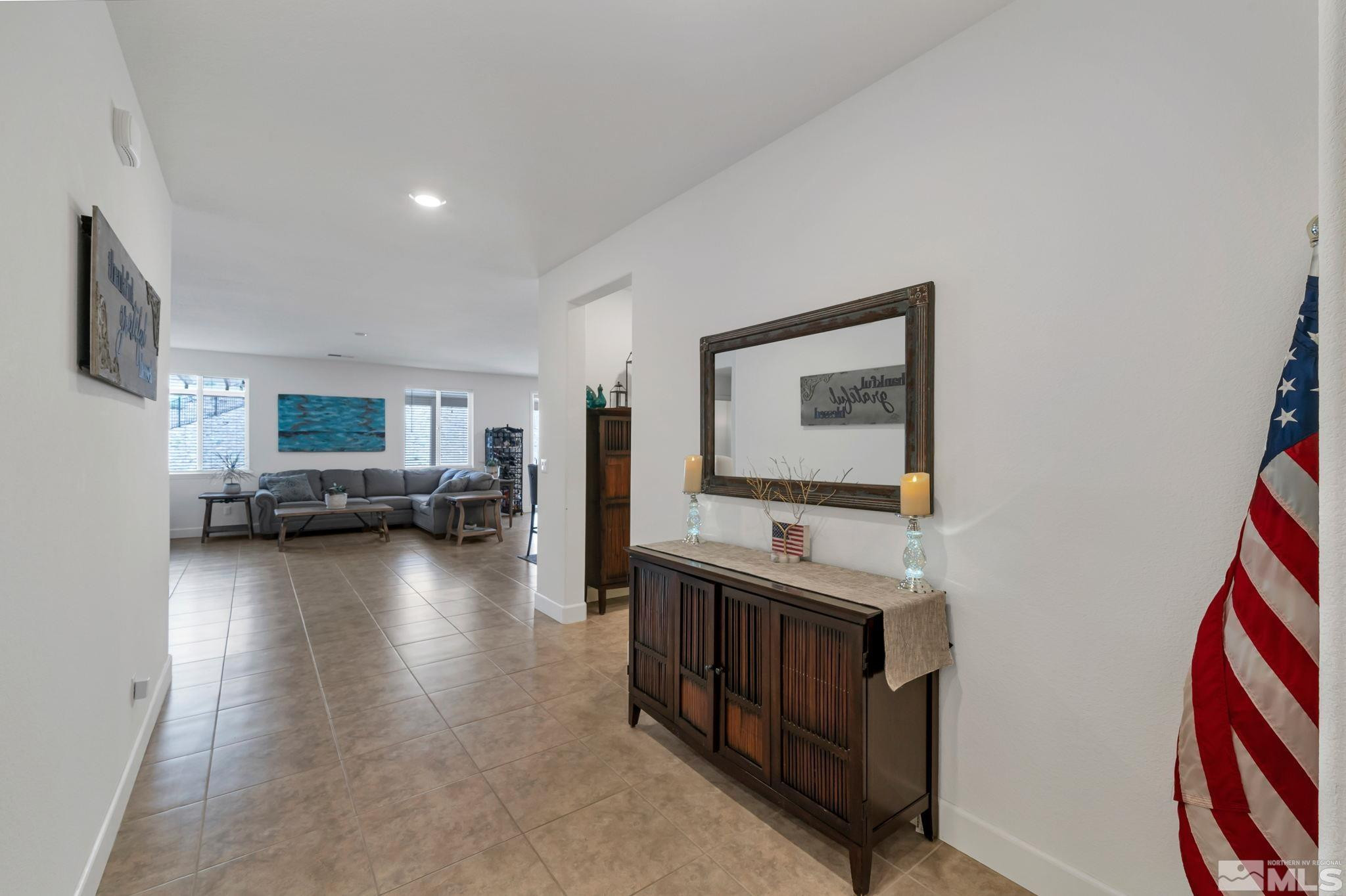 10490 Gold Mine Drive Reno, NV 89521 - Photo 4 of 40 a living room with furniture and a flat screen tv