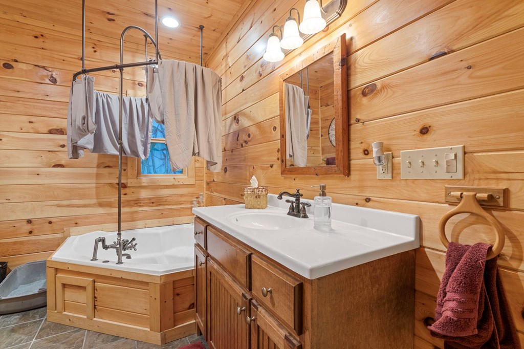 66 Forest Trail Blue Ridge, GA 30513 - Photo 19 of 56 a bathroom with a sink and a mirror