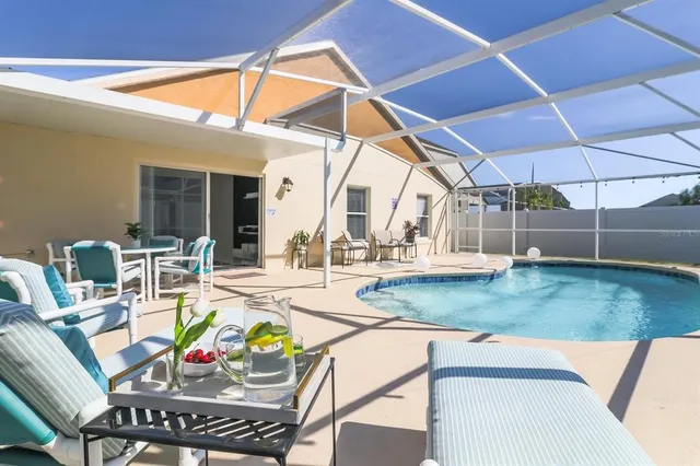 a view of a dining table and chairs in patio