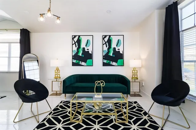 a living room with furniture and a window