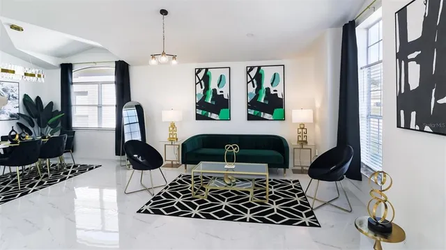 a bedroom with furniture and a window